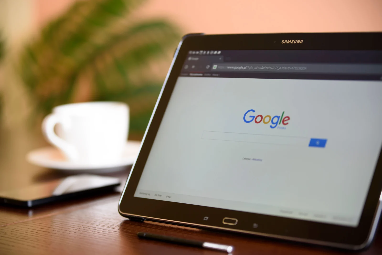 A tablet showing a Google search page on a desk