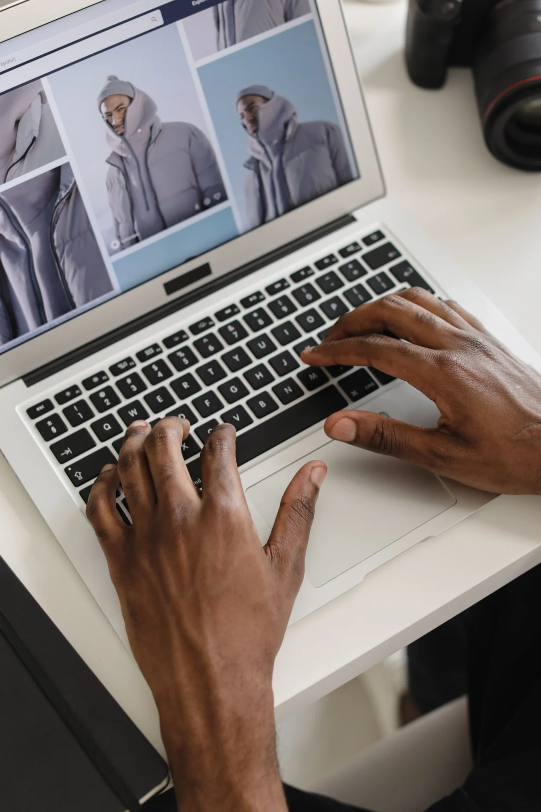 Product photos being edited on a laptop next to a camera
